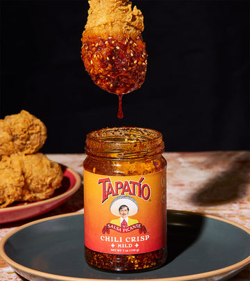Tapatio Chili Crisp Mild spooned over fried chicken