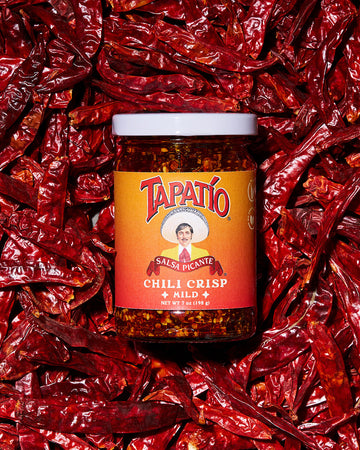 Tapatio Chili Crisp Mild jar on dried red chiles